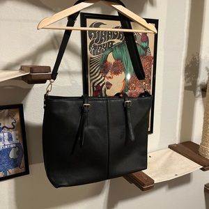 Large black laptop bag with multiple compartments
